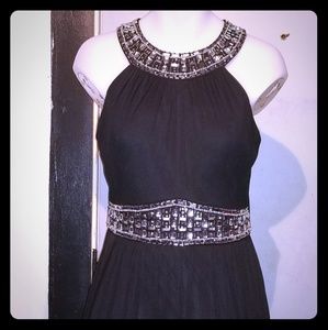 Elegant black crystal embellished gown.